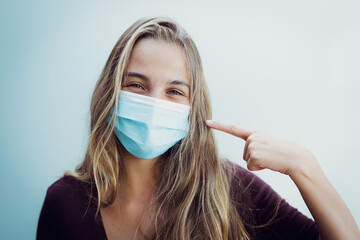 Girl Wearing mask due coronavirus smiling positive concept