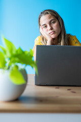 woman with laptop worried