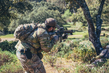 Soldier in a combat situation. Men play airsoft.