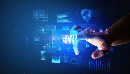 Hand touching CRYPTO MINING inscription, new business technology concept