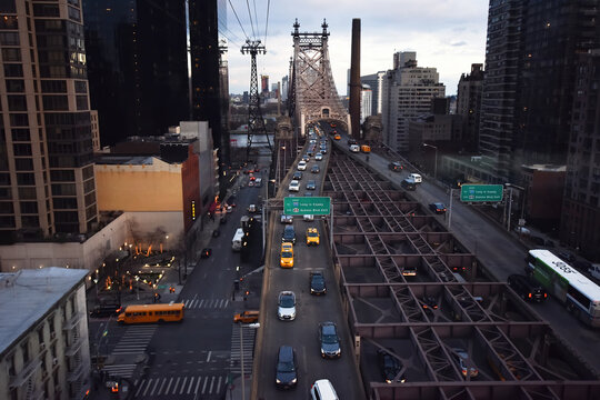 New York City, USA -  December 6, 2019. New York city view from Roosevelt Island cable tram car in winter at sunset.