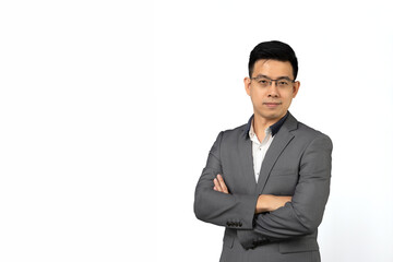 Obraz na płótnie Canvas Portrait of Asian businessman happy smiling in grey confident suit. Isolated on grey background in studio with Clipping Path.