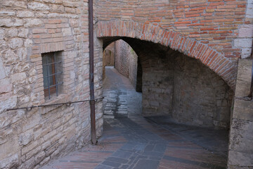 series of arches in the historic center of gubbio umbria italy