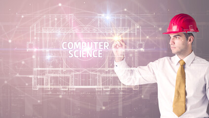 Handsome architect with helmet drawing COMPUTER SCIENCE inscription, new technology concept