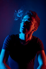 Attractive man smoking cigarette