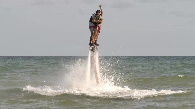 fly board rider in tropical sea, Summer vacation fun outdoor sport,  fly board rider in tropical sea, water sports concept background
