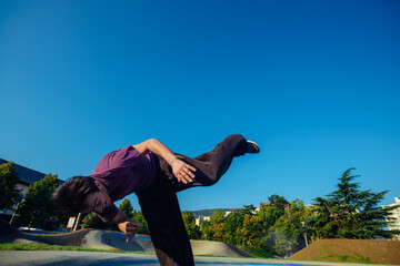 Parkour man doing tricks outdoors