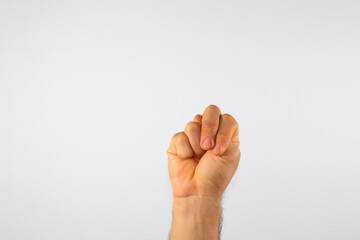Naklejka premium close up of a man's hand communicating with sign language, letters of the alphabet, on a white background