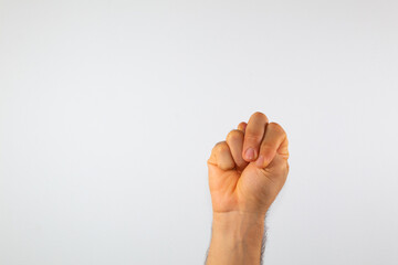 close up of a man's hand communicating with sign language, letters of the alphabet, on a white background