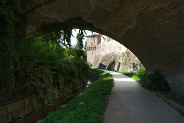 passage under the arch in the village of umbertide umbria italy