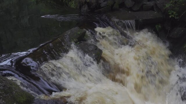 medium waterfall cascade fall in Jukankoski Russian Karelia. Summer forest