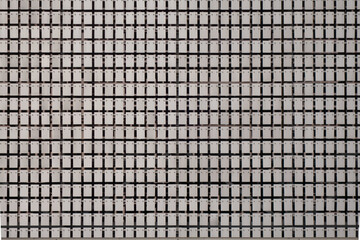 The kinetic facade of the building. Loose metal plates swing in waves in the wind.