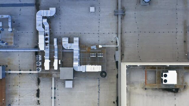 Aerial top down view of the ventilation and air conditioning systems installed on the rooftop