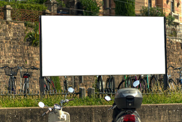 Wide-format billboard on a street in Switzerland, in Ticino