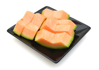 melon slice in plate on white