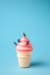 Creative layout made with snowboarders on pink sundae. Minimal colorful winter sports concept.