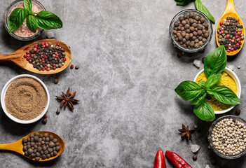 Set of spices on dark marble table with copy space for your text.