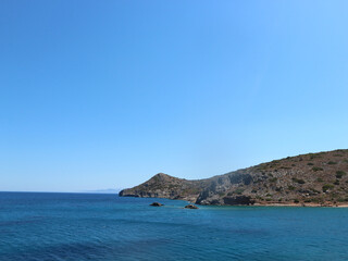 Fototapeta premium Dark Blue Ocean with Small Mountain on the Right Hand Side. Dark blue ocean with mountain on the right. Views off Spinalonga Island