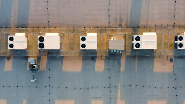 Aerial top down view of the ventilation and air conditioning systems installed on the rooftop