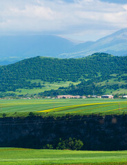 Fototapeta na wymiar Beautiful landscape with village, field and mountains, Armenia