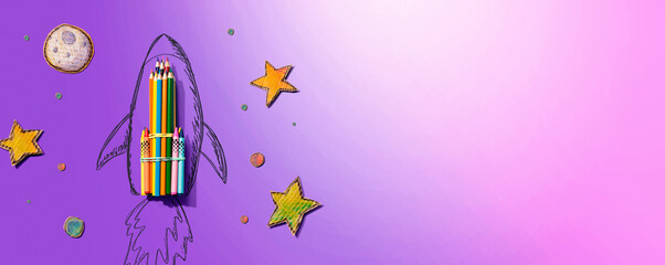 Back to school theme with hand drawn rocket and colored pencils