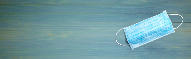 Blue surgical mask overhead view - flat lay