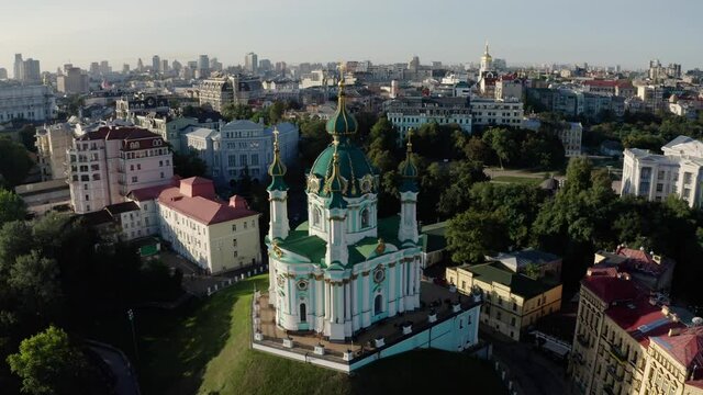 Orthodox Church on green hill in the city Kyiv, Ukraine. Aerial View of St. Andrews Church in the morning