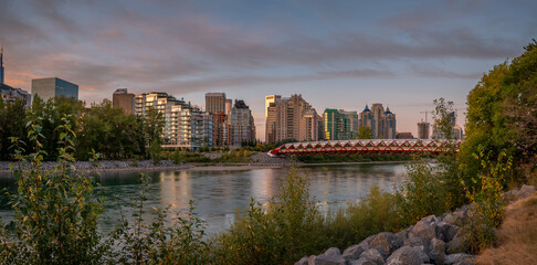 Fototapeta na wymiar View of pedestrian bridge over the Bow River in Calgary Alberta at sunrise. 