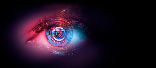 Close-up biometric scan of a female eye. The concept of modern virtual reality. Neon light, cyber...