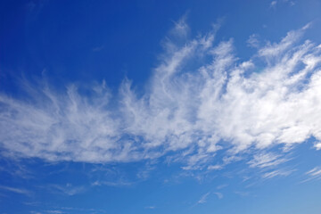 Naklejka na ściany i meble High white clouds in a blue California winter sky