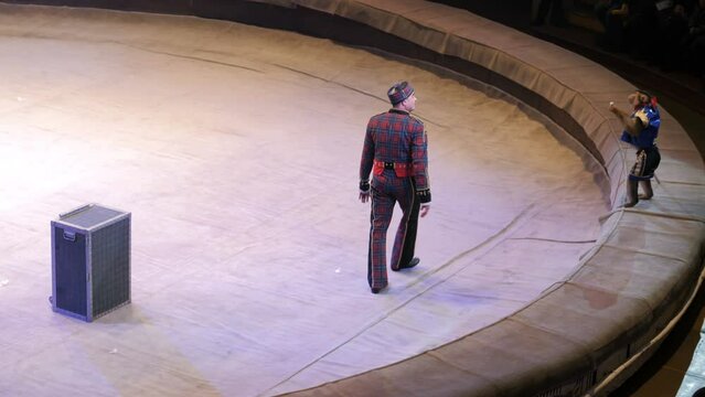 Performance of a monkey trainer in a circus