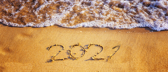 Happy new year 2021 text by the sea. Selective focus. Abstract background photography of the...