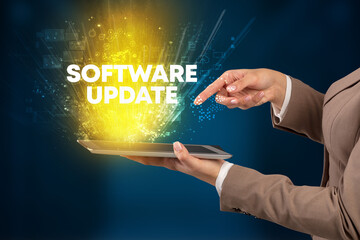Close-up of a touchscreen with SOFTWARE UPDATE inscription, innovative technology concept