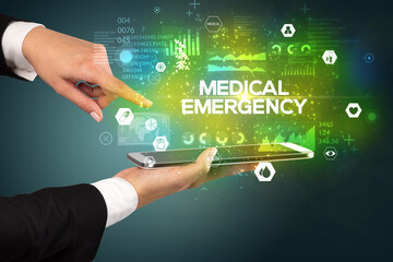Close-up of a touchscreen with MEDICAL EMERGENCY inscription, medical concept