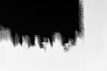 Black and white textured background. Photo of paint with a dynamic leading line and 50/50 contrast between light and dark. Backdrop for graphic resource or decorative copy space on websites