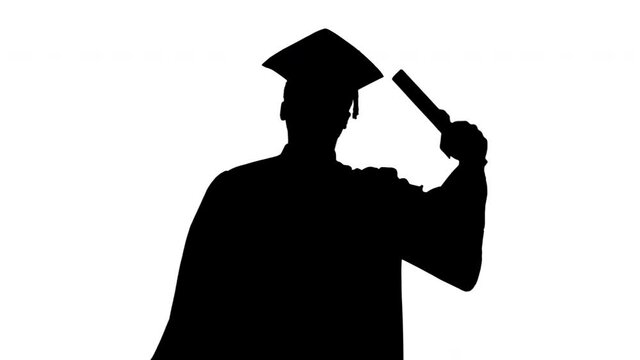 Silhouette Happy african american male student in graduation robe walking with diploma and talking to camera.