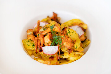 Potatoes with chanterelles. Pretty homemade meal. Cooking and baking food while quarantining  at home during the coronavirus pandemic.