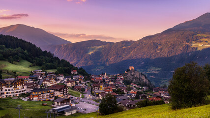 Landscape view of Ladis (Tirol, Austria) at sunset in summer, Tirol mountains on the background