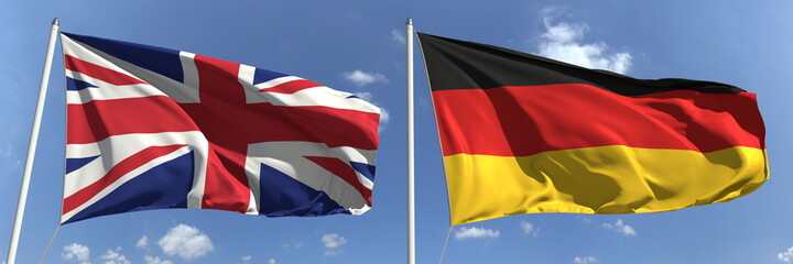 Waving flags of Great Britain and Germany on flagpoles, 3d rendering