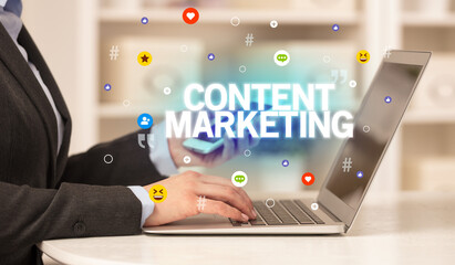 Freelance woman using laptop with CONTENT MARKETING inscription, Social media concept