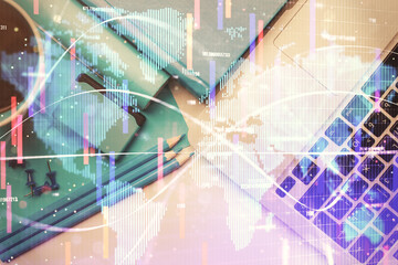 Business theme hologram drawings over computer on the desktop background. Top view. Multi exposure. Concept of international connections.