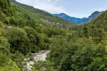 Fototapeta na wymiar Beautiful landscape of the Tineé River Valley, with lots of vegetation and mountains, Provence-Alpes-Côte d'Azur region, Alpes de Haute Provence, France