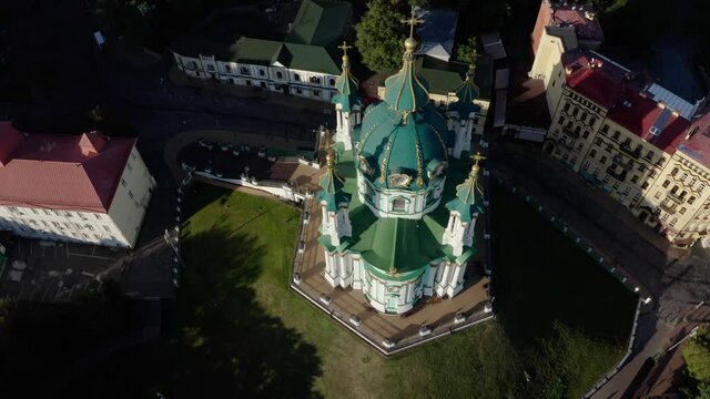 Orthodox Church on green hill in the city Kyiv, Ukraine. Aerial View of St. Andrews Church in the morning