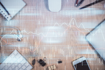 Multi exposure of forex graph hologram over desktop with phone. Top view. Mobile trade platform concept.