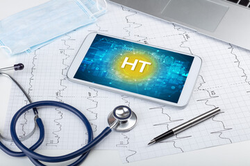 Close-up view of a tablet pc with HT abbreviation, medical concept