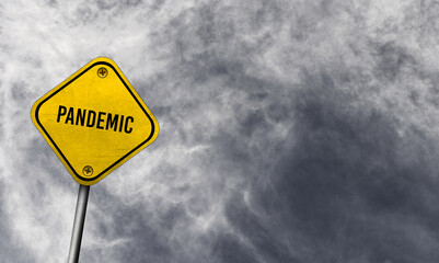 Yellow pandemic sign with cloudy background