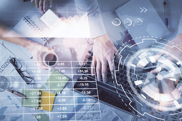 Double exposure of man and woman working together and forex graph hologram drawing. Financial...