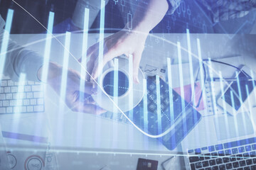 Double exposure of man and woman working together and financial chart hologram drawing. market analysis concept. Computer background. Top View.