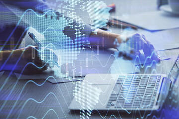 Double exposure of businesswoman hands typing on computer and forex chart hologram drawing. Financial analysis concept.