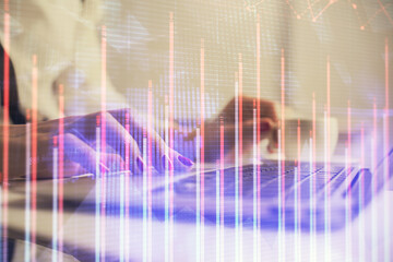 Multi exposure of woman hands typing on computer and financial graph hologram drawing. Stock market analysis concept.